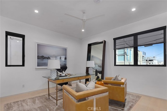 office area with ceiling fan and light wood-type flooring