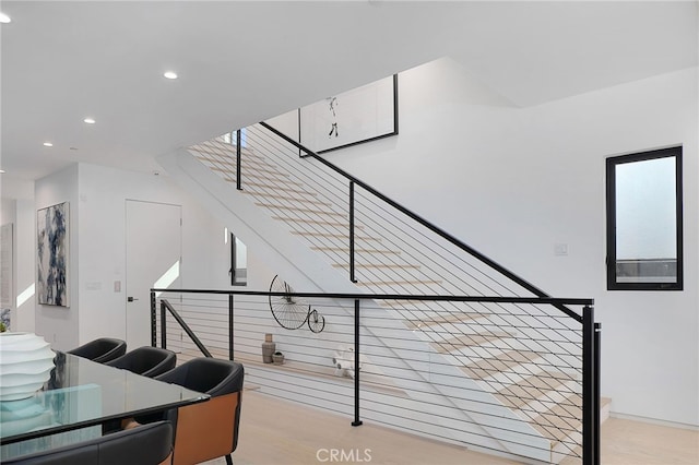 stairway featuring hardwood / wood-style floors