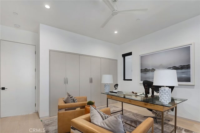 office space featuring ceiling fan and light hardwood / wood-style floors