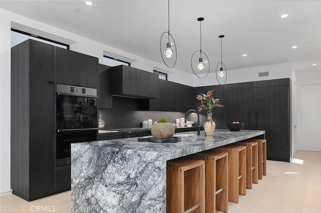 3011 Ocean Front Walk, Venice, CA 90291 - kitchen with double oven, dark cabinets, and modern cabinets