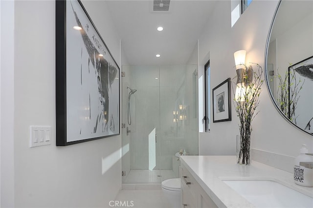 bathroom featuring vanity, tile patterned flooring, a shower with door, and toilet