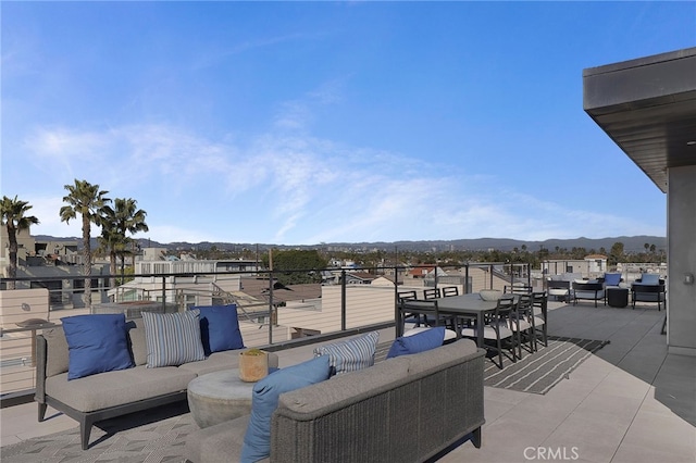 view of patio / terrace featuring a mountain view and an outdoor hangout area