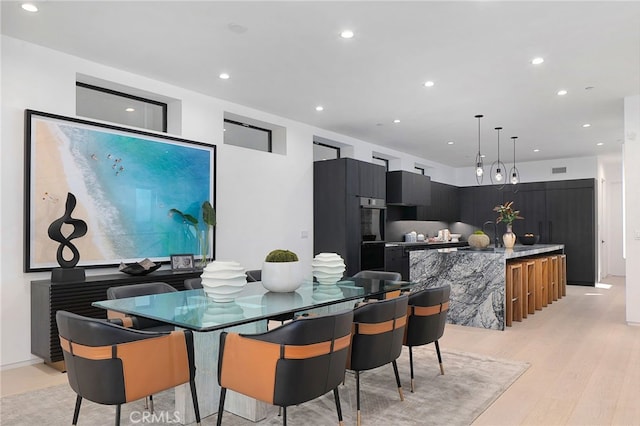 dining room with light wood-type flooring