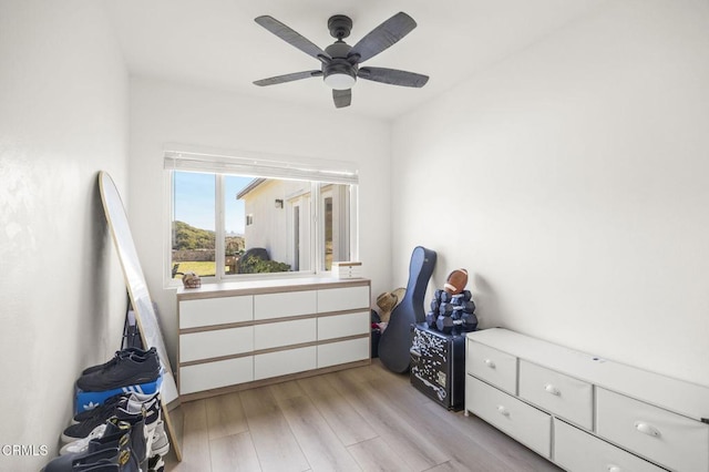 bedroom featuring light hardwood / wood-style floors and ceiling fan