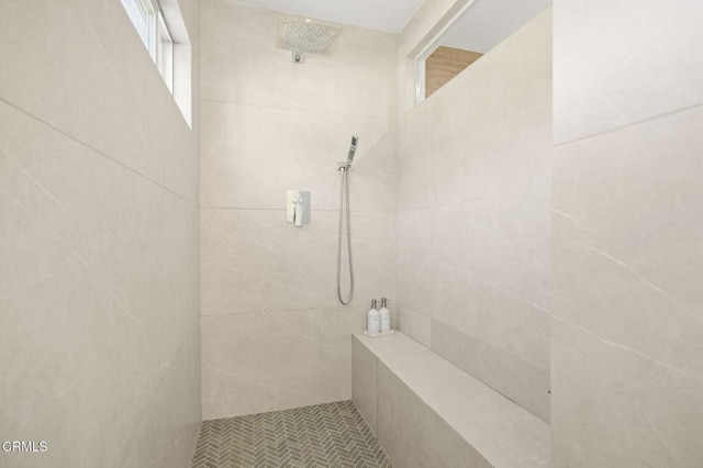 bathroom with a tile shower