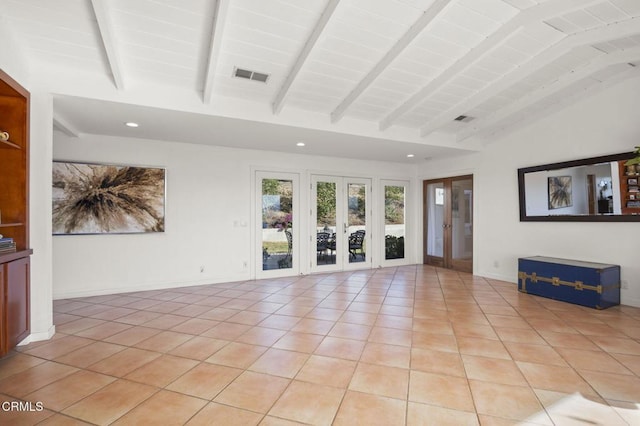 unfurnished living room with lofted ceiling with beams, french doors, wooden ceiling, and light tile patterned flooring