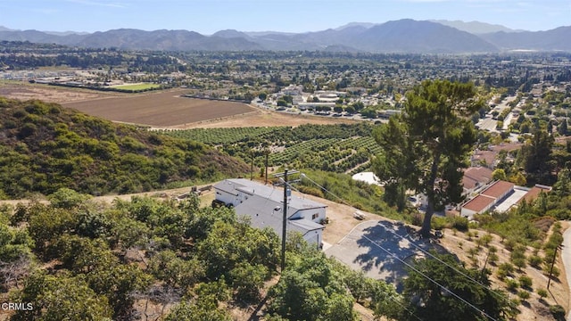 birds eye view of property featuring a mountain view