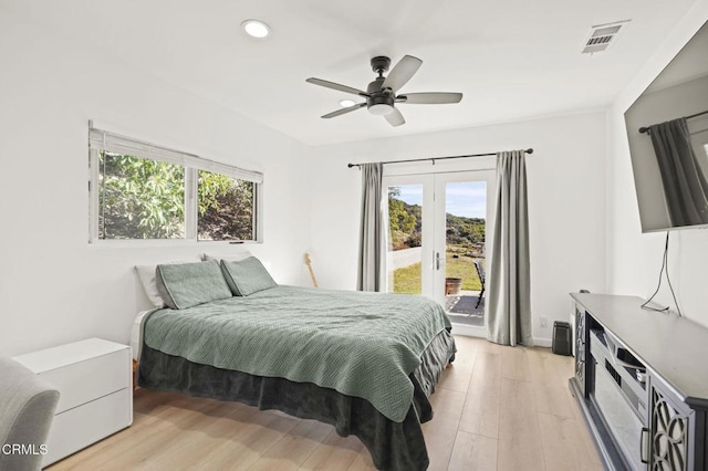 bedroom with french doors, ceiling fan, access to exterior, and light hardwood / wood-style flooring