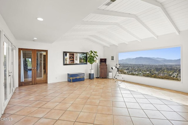 unfurnished living room featuring recessed lighting, vaulted ceiling with beams, french doors, a mountain view, and light tile patterned flooring