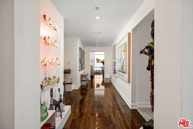 corridor featuring dark hardwood / wood-style floors