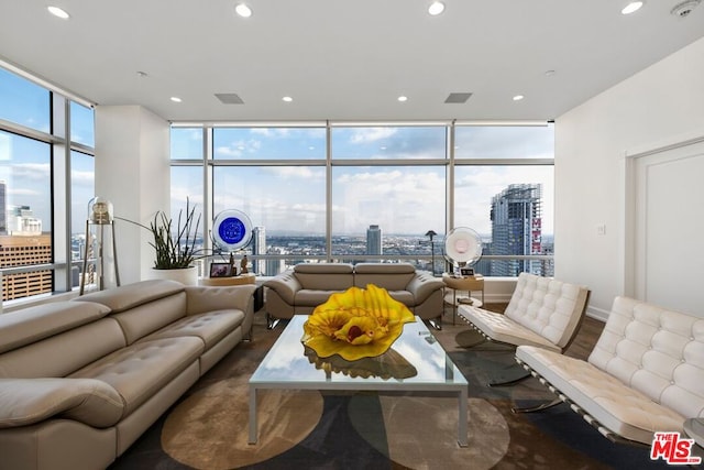 living room featuring floor to ceiling windows