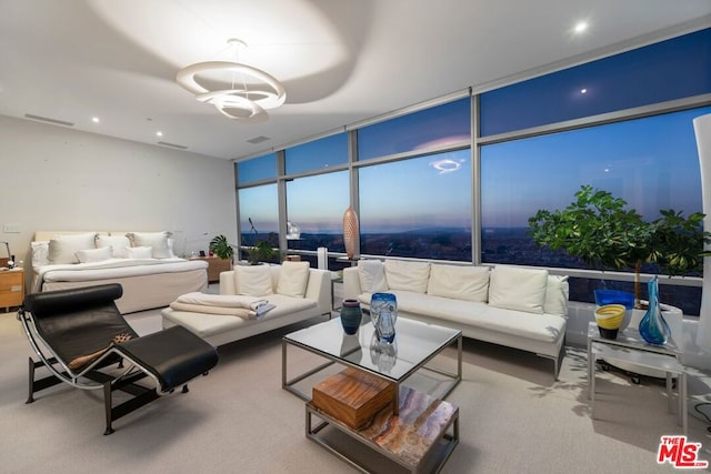 carpeted bedroom featuring floor to ceiling windows