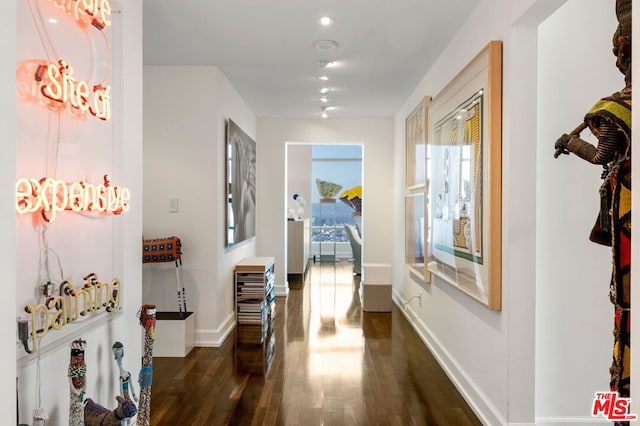 hallway with dark wood-type flooring