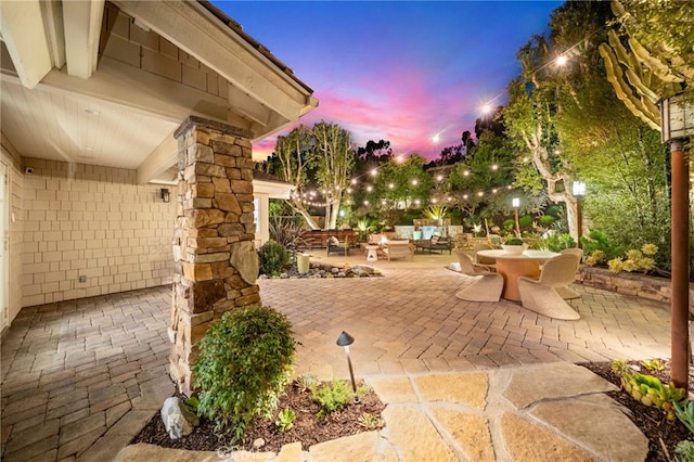 patio terrace at dusk with an outdoor hangout area