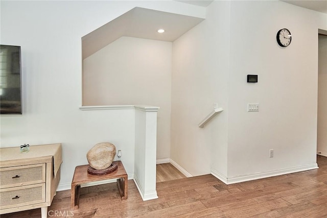 stairs featuring wood-type flooring