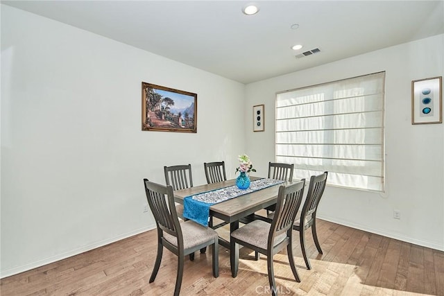 dining room with light hardwood / wood-style floors