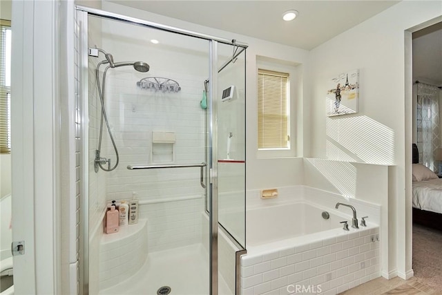 bathroom with separate shower and tub