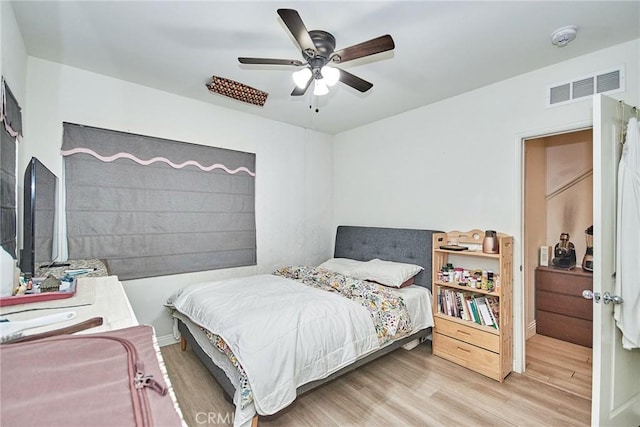 bedroom featuring light hardwood / wood-style flooring and ceiling fan