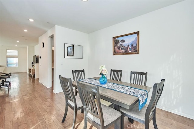 dining area with light wood-type flooring