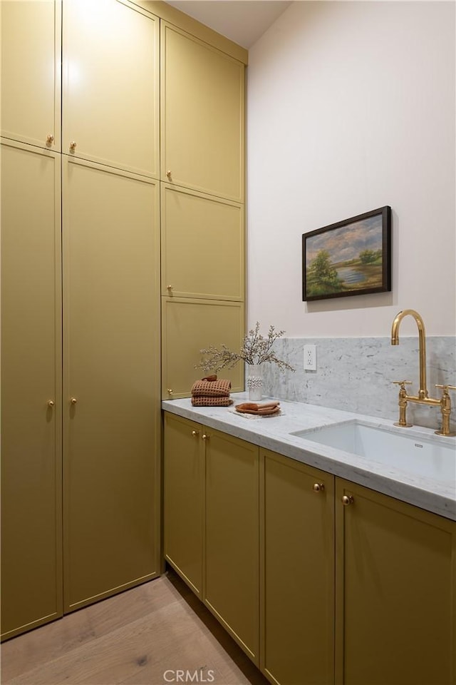 bathroom with wood-type flooring and vanity