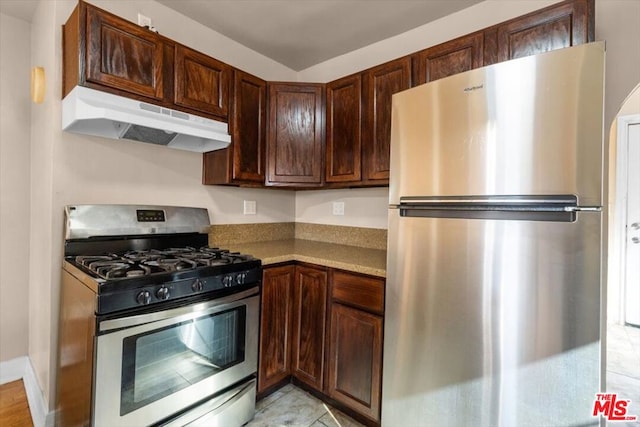 kitchen featuring dark brown cabinets and stainless steel appliances