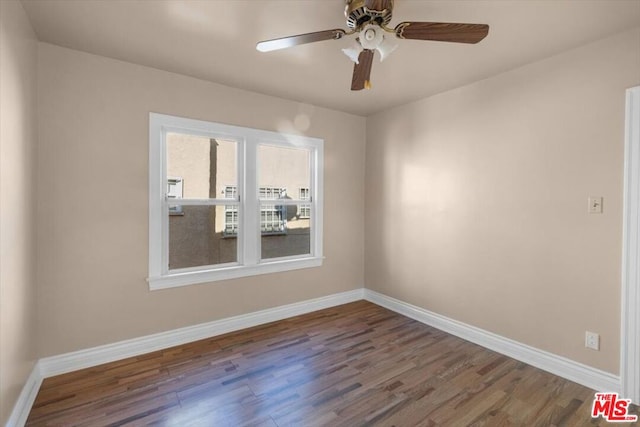 unfurnished room with ceiling fan and hardwood / wood-style flooring