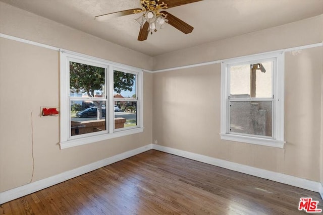 spare room featuring ceiling fan and hardwood / wood-style floors