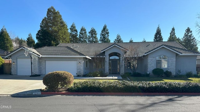 ranch-style home with a garage