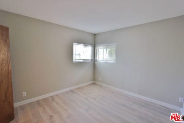 empty room with light hardwood / wood-style floors