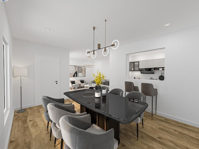 dining space featuring wood-type flooring