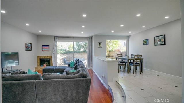 living room featuring tile patterned flooring and a fireplace