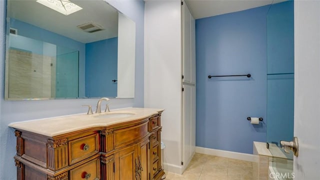 bathroom with vanity and tile patterned floors