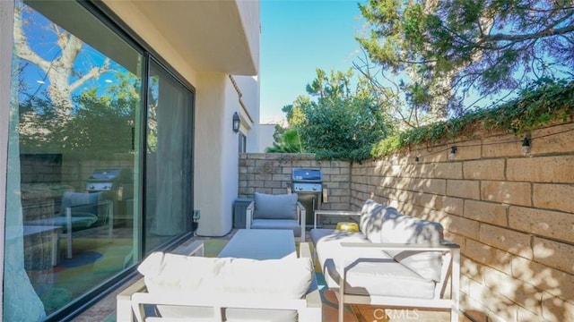 exterior space featuring a grill and an outdoor hangout area