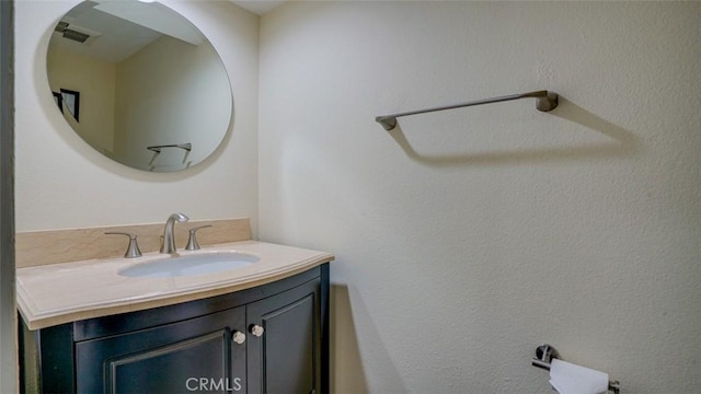 bathroom with visible vents and vanity