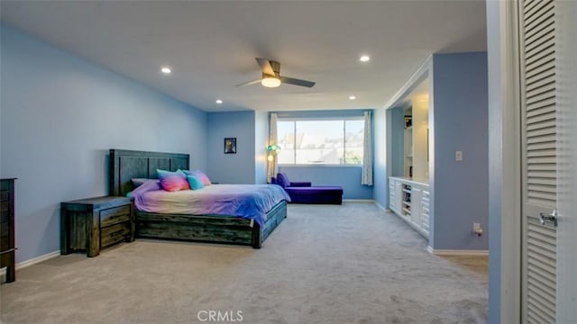 bedroom with light colored carpet and ceiling fan