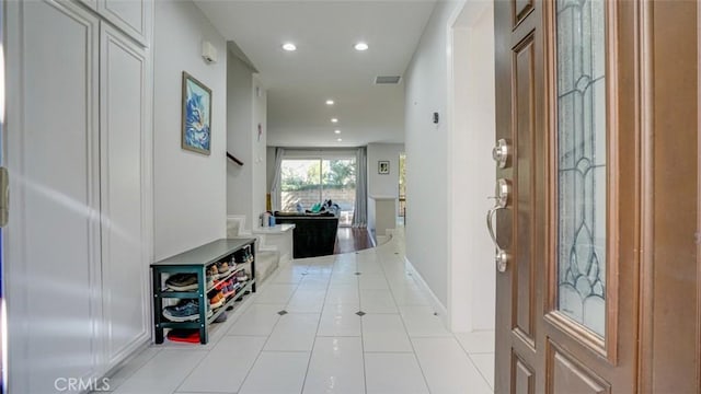 hallway with light tile patterned floors