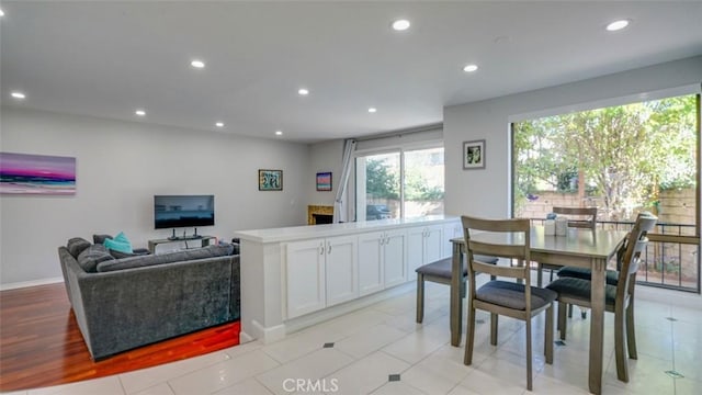 dining room with baseboards and recessed lighting