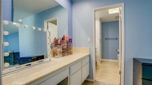 bathroom with vanity and tile patterned flooring