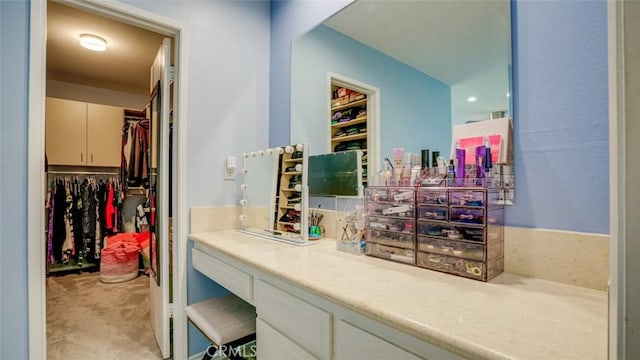 bathroom with a walk in closet