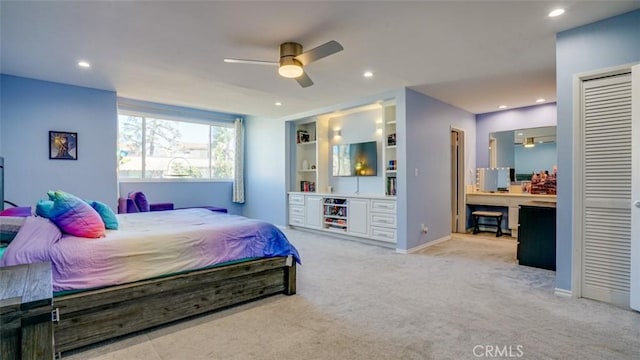 bedroom with light carpet, baseboards, ensuite bathroom, and recessed lighting