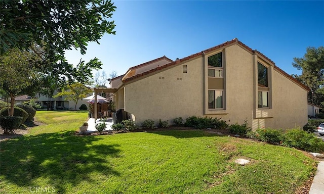 view of home's exterior with a lawn