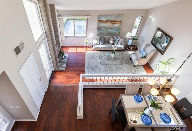 interior space featuring dark hardwood / wood-style floors and a kitchen bar