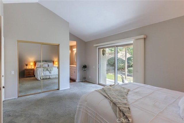 bedroom with lofted ceiling, ensuite bath, carpet floors, a closet, and access to exterior