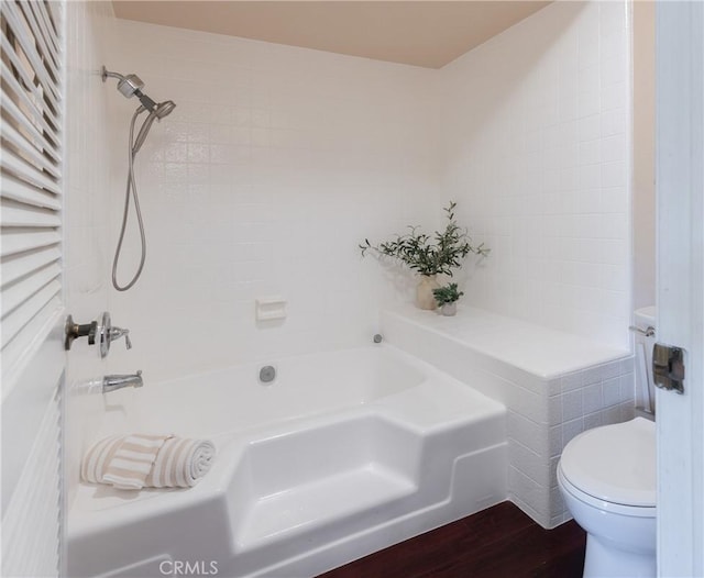 bathroom featuring wood-type flooring and toilet