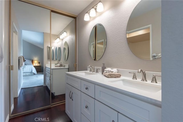 bathroom featuring wood-type flooring and vanity