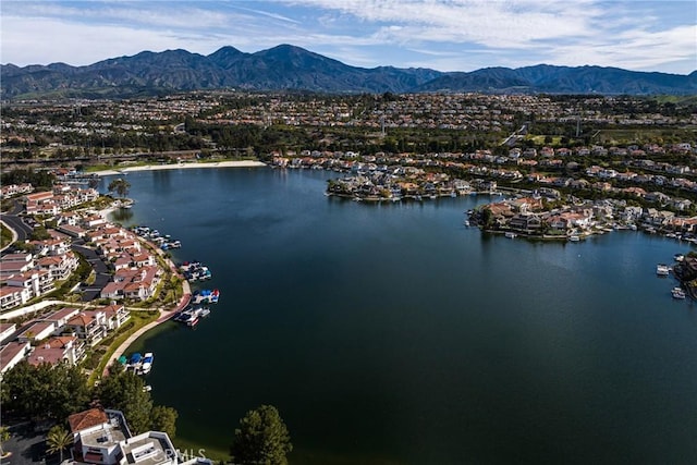 drone / aerial view with a water and mountain view