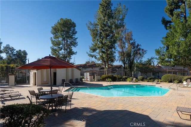 view of swimming pool with a patio area