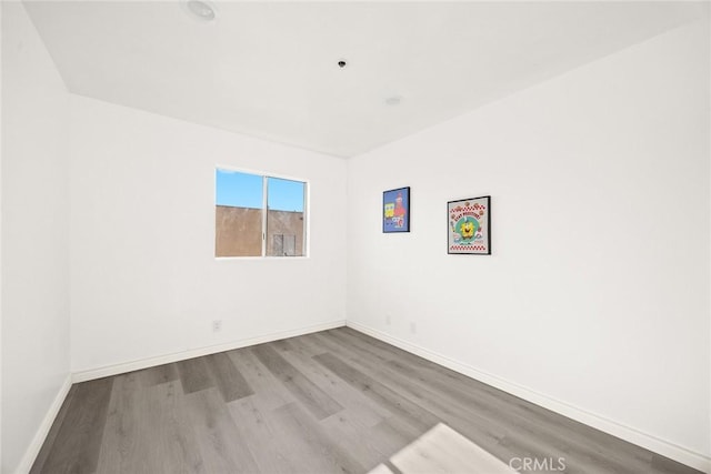 empty room featuring hardwood / wood-style flooring