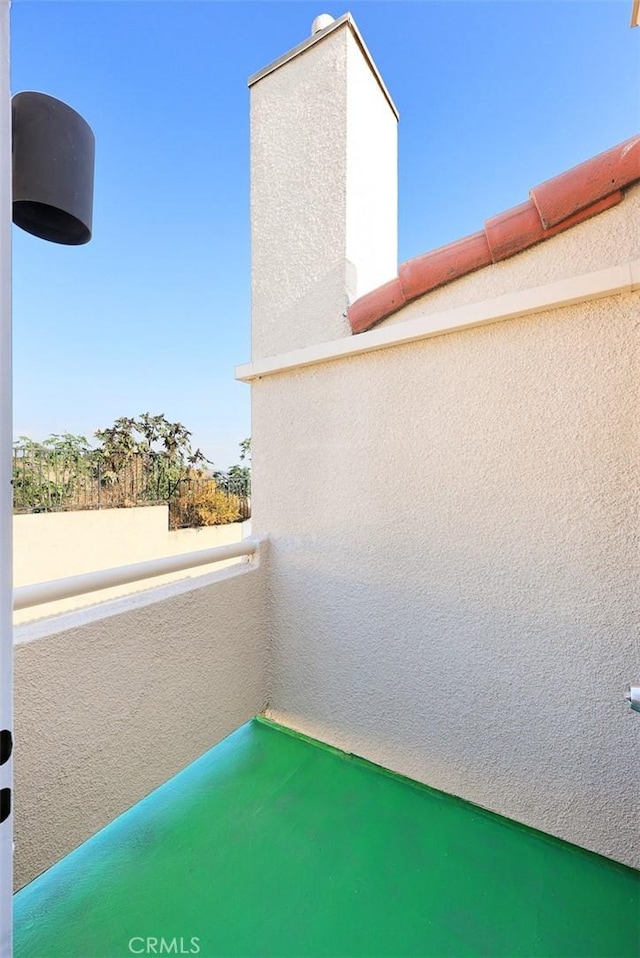 view of patio featuring a balcony