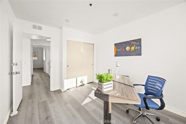 office space featuring light wood-type flooring